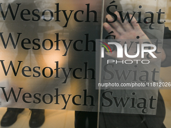 WARSAW, POLAND - NOVEMBER 19:   
Happy Christmas'' (Polish: ''Wesolych Swiat'') stickers placed in a shop window, ready for the holiday seas...