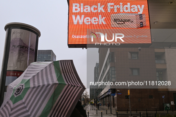 WARSAW, POLAND - NOVEMBER 19:   
A 'Black Friday' ad displayed on a screen outside a retail store, promoting seasonal discounts, on November...