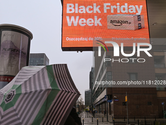 WARSAW, POLAND - NOVEMBER 19:   
A 'Black Friday' ad displayed on a screen outside a retail store, promoting seasonal discounts, on November...