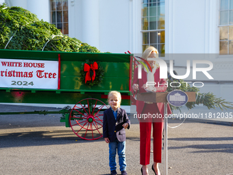 Presidential grandson Beau Biden joins the First Lady at the arrival of the White House Christmas Tree. The tree from North Carolina is deli...