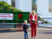 Presidential grandson Beau Biden joins the First Lady at the arrival of the White House Christmas Tree. The tree from North Carolina is deli...