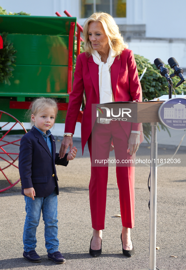 Presidential grandson Beau Biden joins the First Lady at the arrival of the White House Christmas Tree. The tree from North Carolina is deli...