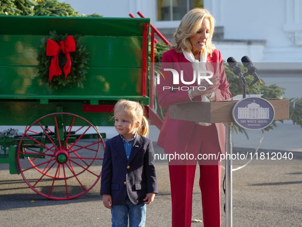 Presidential grandson Beau Biden joins the First Lady at the arrival of the White House Christmas Tree. The tree from North Carolina is deli...