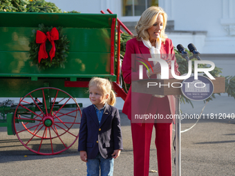 Presidential grandson Beau Biden joins the First Lady at the arrival of the White House Christmas Tree. The tree from North Carolina is deli...