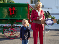 Presidential grandson Beau Biden joins the First Lady at the arrival of the White House Christmas Tree. The tree from North Carolina is deli...