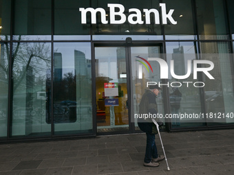 WARSAW, POLAND - NOVEMBER 19:   
The mBank logo displayed at the entrance to a bank office, on November 19, 2024 in Warsaw, Poland. (