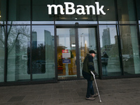 WARSAW, POLAND - NOVEMBER 19:   
The mBank logo displayed at the entrance to a bank office, on November 19, 2024 in Warsaw, Poland. (