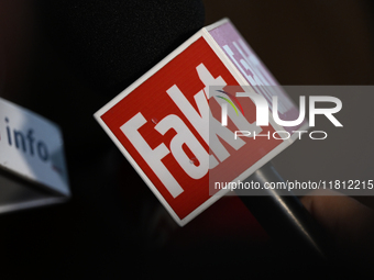 KRAKOW, POLAND - NOVEMBER 24:
A TV Fakt microphone held by a Fakt reporter outside the venue where Karol Nawrocki was officially introduced...