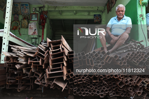 A trader sits inside his shop at a wholesale steel and iron market in Kolkata, India, on November 26, 2024. In November 2024, India's domest...