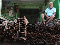 A trader sits inside his shop at a wholesale steel and iron market in Kolkata, India, on November 26, 2024. In November 2024, India's domest...