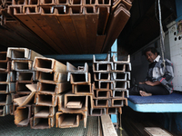 A trader sits inside his shop at a wholesale steel and iron market in Kolkata, India, on November 26, 2024. In November 2024, India's domest...