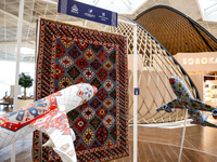 Models of planes and Azerbaijan traditional carpet are seen in Heydar Aliyev Airport in Baku, the capital of Azerbaijan on November 26, 2024...