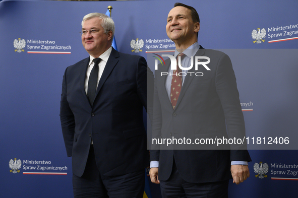 Poland's Minister of Foreign Affairs, Radoslaw Sikorski (R), welcomes Ukraine's Foreign Affairs Minister, Andrii Sybiha (L), before a press...