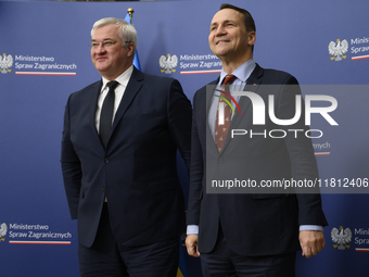 Poland's Minister of Foreign Affairs, Radoslaw Sikorski (R), welcomes Ukraine's Foreign Affairs Minister, Andrii Sybiha (L), before a press...