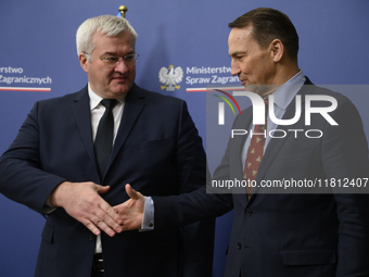 Poland's Minister of Foreign Affairs Radoslaw Sikorski (right) shakes hands with Ukraine's Foreign Affairs Minister Andrii Sybiha (left) bef...