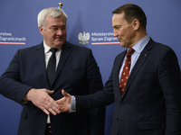 Poland's Minister of Foreign Affairs Radoslaw Sikorski (right) shakes hands with Ukraine's Foreign Affairs Minister Andrii Sybiha (left) bef...