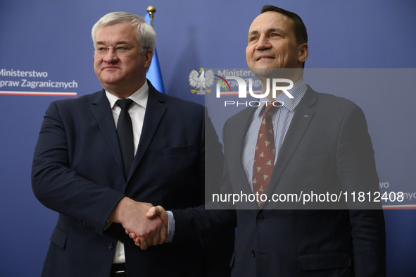 Poland's Minister of Foreign Affairs Radoslaw Sikorski (right) shakes hands with Ukraine's Foreign Affairs Minister Andrii Sybiha (left) bef...