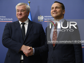 Poland's Minister of Foreign Affairs Radoslaw Sikorski (right) shakes hands with Ukraine's Foreign Affairs Minister Andrii Sybiha (left) bef...