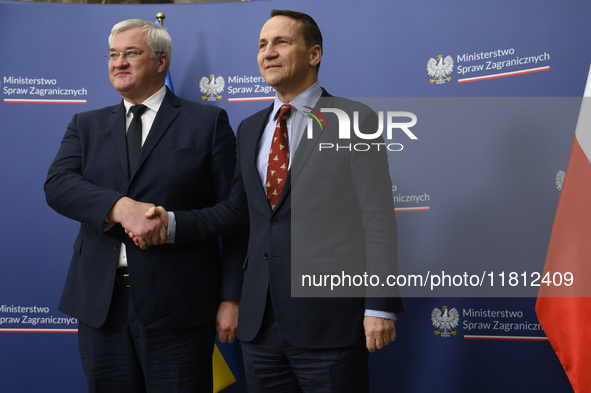 Poland's Minister of Foreign Affairs Radoslaw Sikorski (right) shakes hands with Ukraine's Foreign Affairs Minister Andrii Sybiha (left) bef...