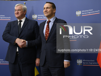 Poland's Minister of Foreign Affairs Radoslaw Sikorski (right) shakes hands with Ukraine's Foreign Affairs Minister Andrii Sybiha (left) bef...