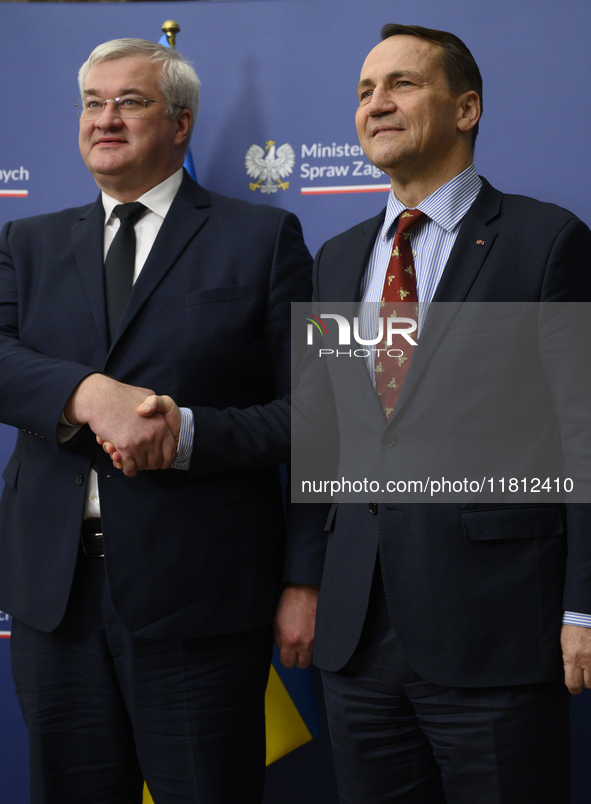 Poland's Minister of Foreign Affairs Radoslaw Sikorski (right) shakes hands with Ukraine's Foreign Affairs Minister Andrii Sybiha (left) bef...