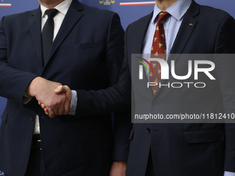 Poland's Minister of Foreign Affairs Radoslaw Sikorski (right) shakes hands with Ukraine's Foreign Affairs Minister Andrii Sybiha (left) bef...