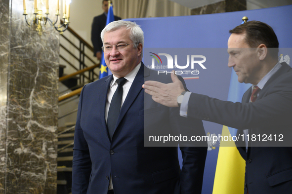 Poland's Minister of Foreign Affairs, Radoslaw Sikorski (R), welcomes Ukraine's Foreign Affairs Minister, Andrii Sybiha (L), before a press...