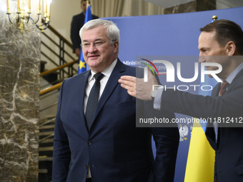 Poland's Minister of Foreign Affairs, Radoslaw Sikorski (R), welcomes Ukraine's Foreign Affairs Minister, Andrii Sybiha (L), before a press...