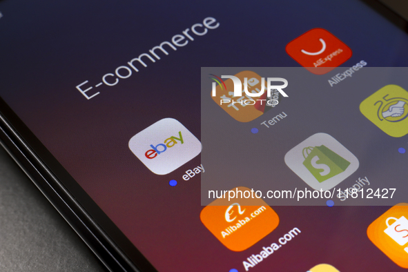 The e-commerce services eBay, Temu, AliExpress, Alibaba, Shopify, and Mercado Libre app appear on the screen of a smartphone in Reno, United...