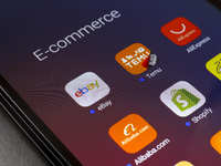 The e-commerce services eBay, Temu, AliExpress, Alibaba, Shopify, and Mercado Libre app appear on the screen of a smartphone in Reno, United...