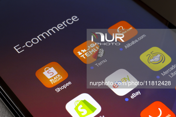 The e-commerce services Shopee, Temu, Alibaba, Shopify, eBay, and Mercado Libre apps appear on the screen of a smartphone in Reno, United St...