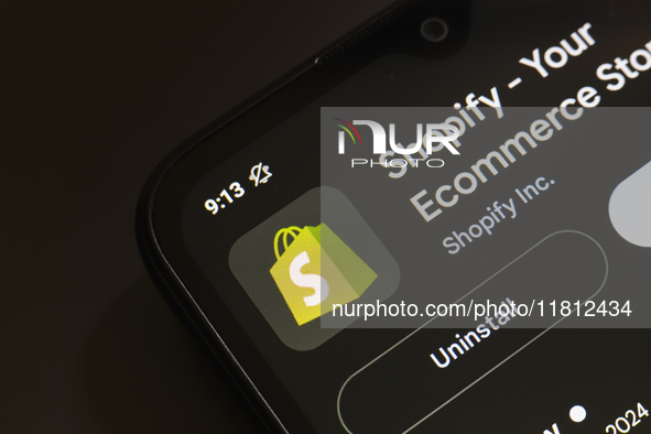 The Shopify app logo appears on the screen of a smartphone in Reno, United States, on November 26, 2024. 