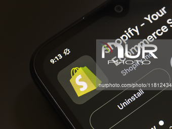 The Shopify app logo appears on the screen of a smartphone in Reno, United States, on November 26, 2024. (