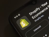 The Shopify app logo appears on the screen of a smartphone in Reno, United States, on November 26, 2024. (