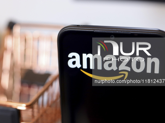 The Amazon logo appears on the screen of a smartphone in Reno, United States, on November 26, 2024. (