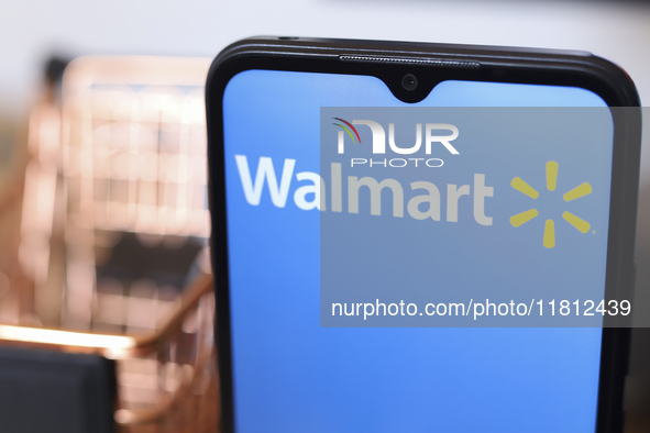 The Walmart logo appears on the screen of a smartphone in Reno, United States, on November 26, 2024. 