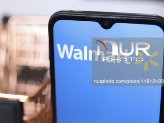 The Walmart logo appears on the screen of a smartphone in Reno, United States, on November 26, 2024. (