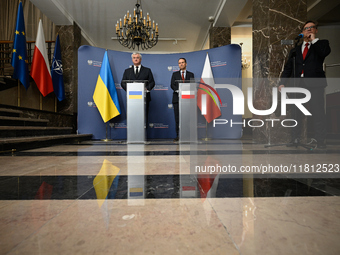 Ukrainian FM Andrii Sybiha (l) meets with his counterpart Radoslaw Sikorski (r) at the Ministry of Foreign Affairs in Warsaw, Poland on 26 N...