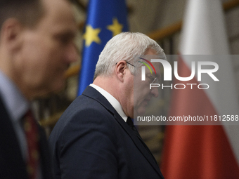 Ukraine's Foreign Affairs Minister Andrii Sybiha (center) and Poland's Minister of Foreign Affairs Radoslaw Sikorski (left) arrive at a pres...