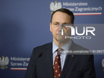 Poland's Minister of Foreign Affairs, Radoslaw Sikorski, looks on as he participates in a press conference after talks with his Ukrainian co...