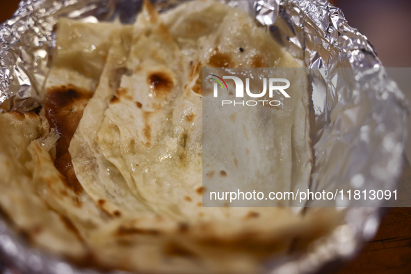 Butter naan is seen in this illustration photo taken in the Indian restaurant in Krakow, Poland on November 25, 2024. 