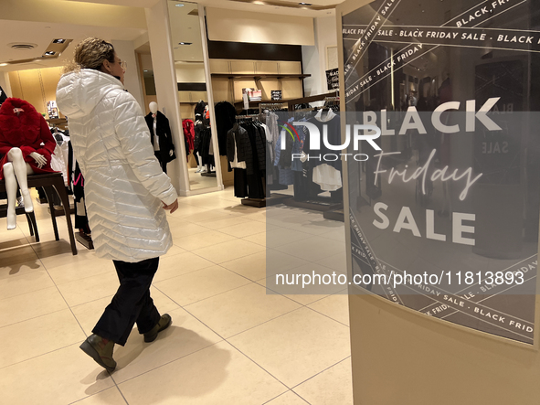 Signs for Black Friday sales are in stores at a shopping mall in Toronto, Ontario, Canada, on November 26, 2024 