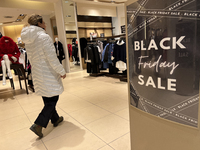 Signs for Black Friday sales are in stores at a shopping mall in Toronto, Ontario, Canada, on November 26, 2024 (