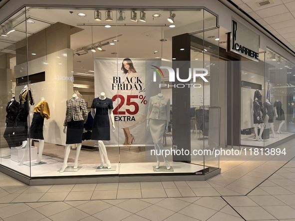 Signs for Black Friday sales are in stores at a shopping mall in Toronto, Ontario, Canada, on November 26, 2024 