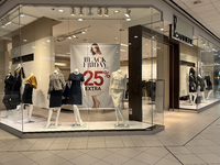 Signs for Black Friday sales are in stores at a shopping mall in Toronto, Ontario, Canada, on November 26, 2024 (