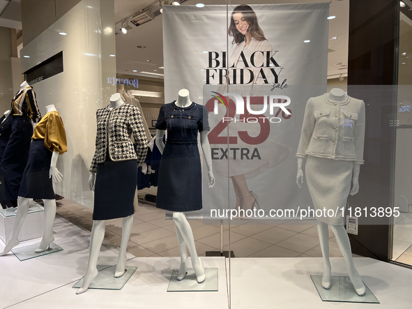 Signs for Black Friday sales are in stores at a shopping mall in Toronto, Ontario, Canada, on November 26, 2024 