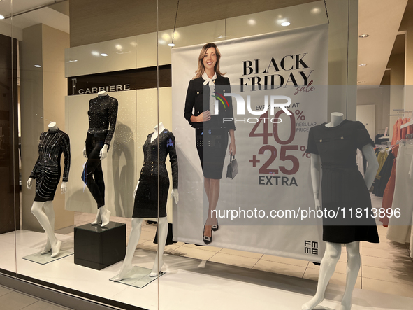 Signs for Black Friday sales are in stores at a shopping mall in Toronto, Ontario, Canada, on November 26, 2024 