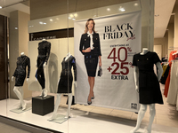 Signs for Black Friday sales are in stores at a shopping mall in Toronto, Ontario, Canada, on November 26, 2024 (