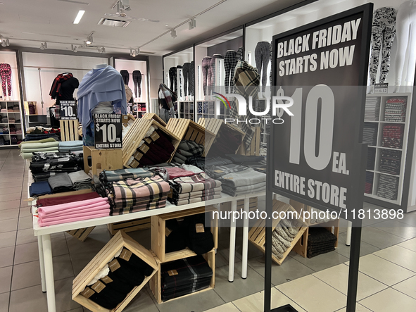 Signs for Black Friday sales are in stores at a shopping mall in Toronto, Ontario, Canada, on November 26, 2024 