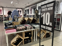 Signs for Black Friday sales are in stores at a shopping mall in Toronto, Ontario, Canada, on November 26, 2024 (